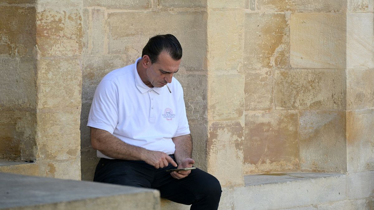 Restaurant worker on smoke break, Dijon, 2026