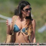 Claudia Romani Flashes Her Cleavage and Shapely Derriere in an Exotic Bikini