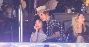 Justin-Bieber-on-Ashley-Moore-Lap-Gets-Close-Kisses-Her-Forehead